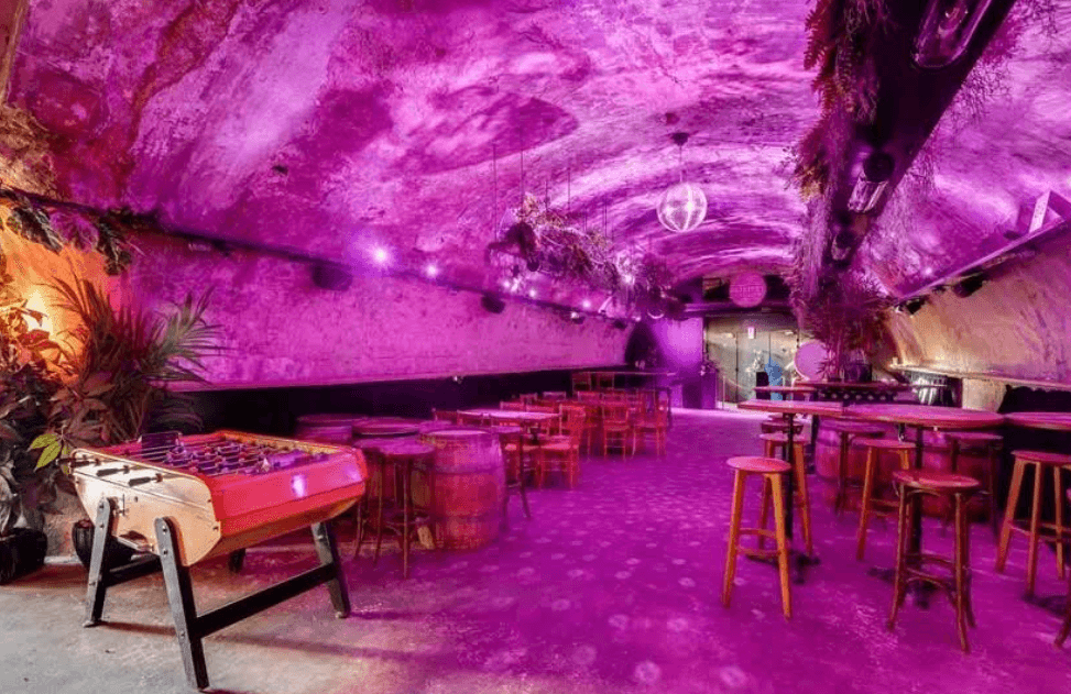 Underground Rustic Bar Jungle-Inspired Rustic Underground Bar With Neon Lighting for Lively ...