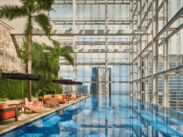 Luxe Rooftop Sky Pool Deck With Palm Groves and Expansive Glass Façades ...