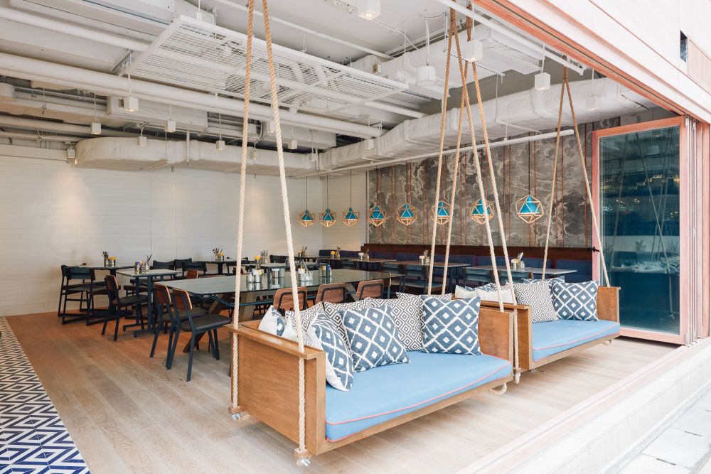 Playful Eatery With Suspended Swing Benches and Open Space for Laid ...