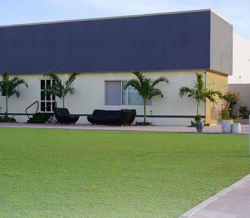 Charming Open-Air Venue With Verdant Gardens and Shaded Courtyards for Relaxing Team Retreats. Levant Park. Garden with Courtyard