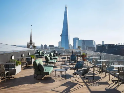 Modern Rooftop Gem Framed by Iconic Spires for Elevated Sunset Receptions. Spaces & Stories The Monument. The Rooftop