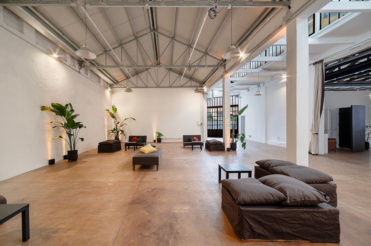 Industrial Hall With Steel Trusses and Lounge Corners for Receptions in ...